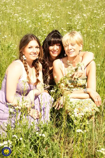 Brunette MILF Undresses for Lesbian Threesome Outdoors