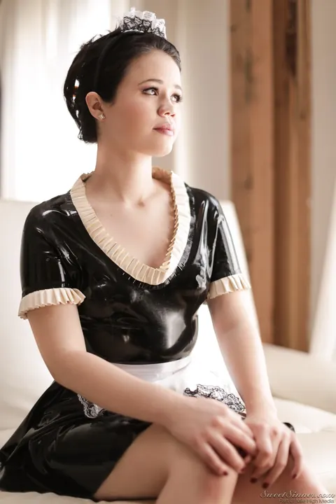 Yhivi: Brunette in Latex Maid Uniform Strips by the Window – photo 1 of 15