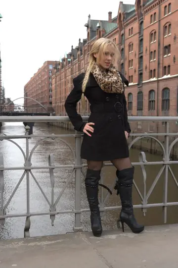 CELINE DAVIS – Blonde European Flaunts Her Enhanced Tits in Boots