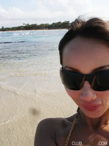 Katsuni – Mature Asian Woman Poses in a Bikini and Shorts on the Beach