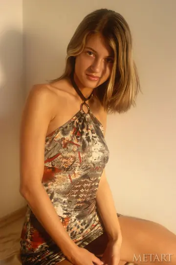 Slim Short-Haired Blonde Strips Nude and Poses