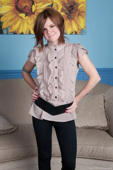 Pale Redhead Spreads Her Hairy Pussy on the Sofa