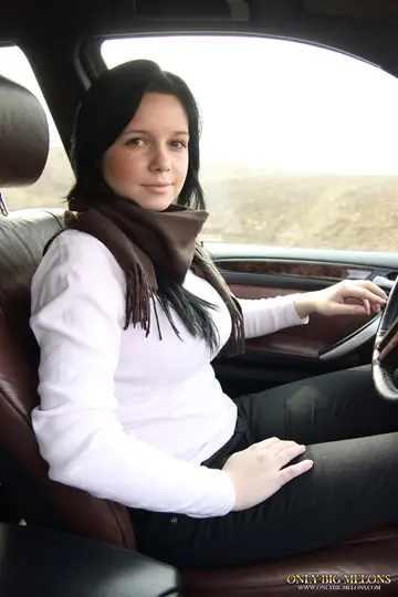 Brunette with Big Natural Tits Spreads and Kisses Her Partner in a Car
