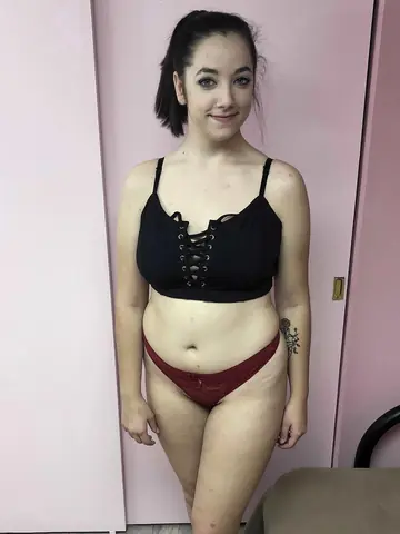 Curvy Brunette Pulls Panties Aside and Fingers Her Pussy