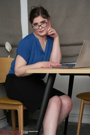 Aurora Frost – Busty British MILF Secretary Strips at Her Desk