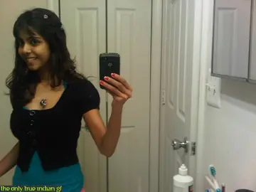 Indian Babe with Big Tits Poses in a Skirt and Panties for Mirror Selfies