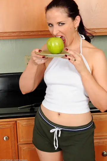 Busty MILF Spreads Her Pierced Pussy in the Kitchen