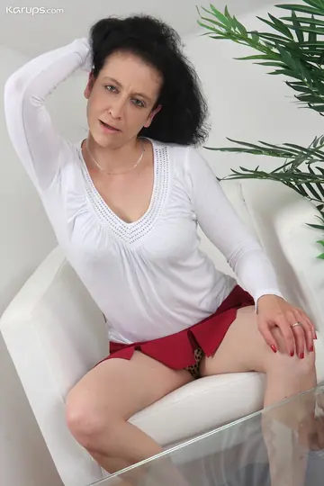 Mature Busty Woman in Lingerie and Skirt Fingers and Uses a Dildo