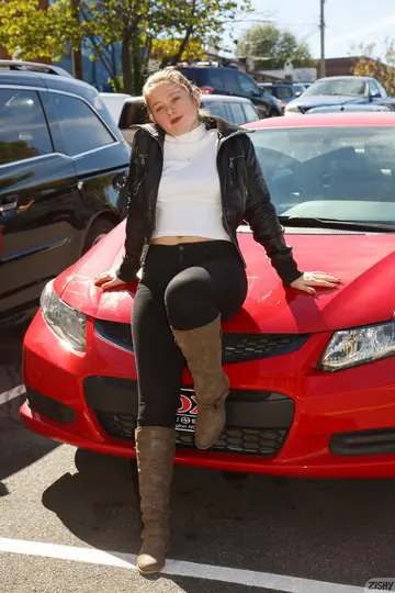 Petite Curvy Brunette Poses Naked in Boots Inside a Car