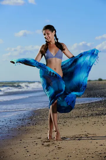 Busty Brunette in Pigtails Strips and Fingers Her Pussy on the Beach