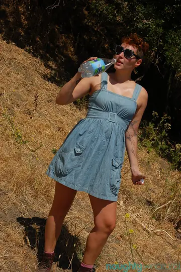 Short-Haired Tanned MILF Pulls Panties Aside Outdoors