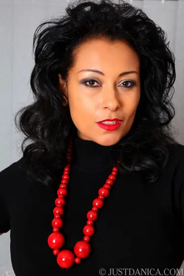Danica Collins – Busty Ebony MILF in Stockings and Leather Gloves Fingers Her Trimmed Pussy