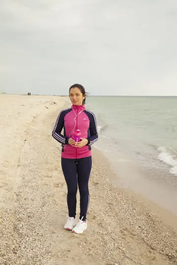 Woman with Small Tits Spreads Her Shaved Pussy on the Beach