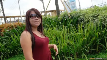 Chubby Asian Woman in Glasses Gives a Blowjob Outdoors
