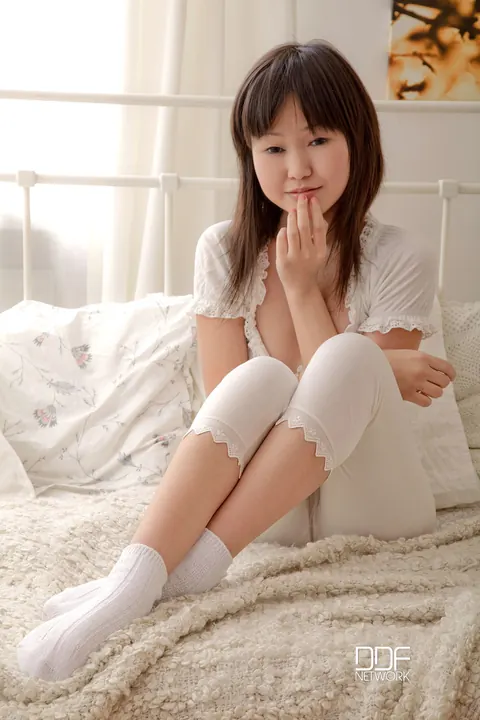 Asian Brunette in Socks Strips and Shows Her Muff – photo 2 of 20