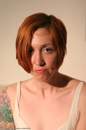 Short-Haired Redhead MILF Spreads Her Hairy Pussy