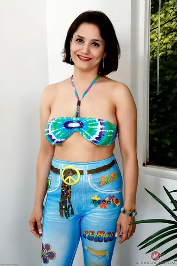 Mature Short-Haired Brunette in a Bikini Reveals Her Big Tits and Spreads