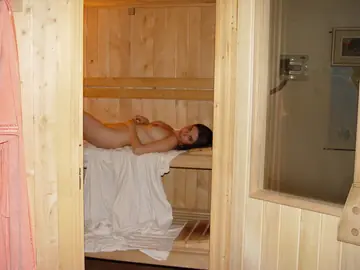 Busty Woman Fingers Herself and Uses a Dildo in the Sauna