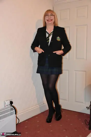 Curvy British MILF Strips Out of Her Uniform and Rolls Down Her Hose