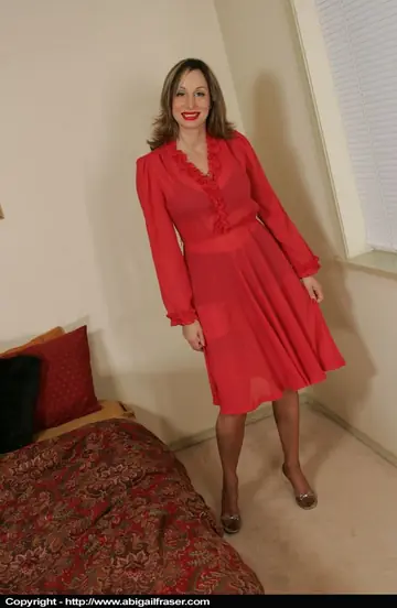 Abigail Fraser – Redhead MILF Strips Off Her Skirt in Lingerie and Stockings