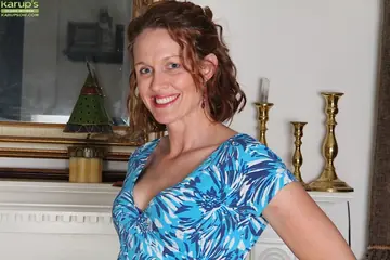 Roxanne Clemmens – Mature Redhead in Heels Spreads Her Trimmed Pussy