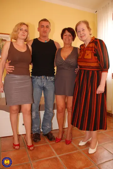 European MILF in a Dress Gives Group Blowjobs for Facials