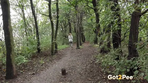 Woman Pulls Down Pants and Pees in the Forest – photo 15 of 15
