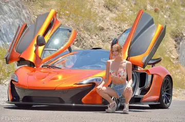Anya Amsel – Slim Blonde with Natural Tits Masturbates by a Sports Car
