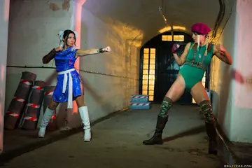 Christen Courtney – Asian Blonde and Brunette in Costumes and Boots Strip for Lesbian Sex Outdoors