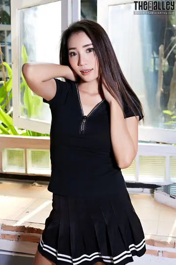 Asian Brunette with Big Tits and Piercing Shows Off in a Skirt