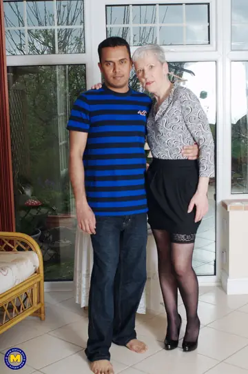 Slim Mature European Woman Fucks a Black Man on the Sofa