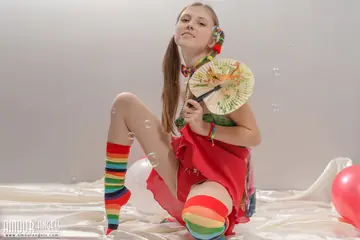 Slim Latina in Pigtails Lifts Her Skirt and Spreads Her Hairy Pussy