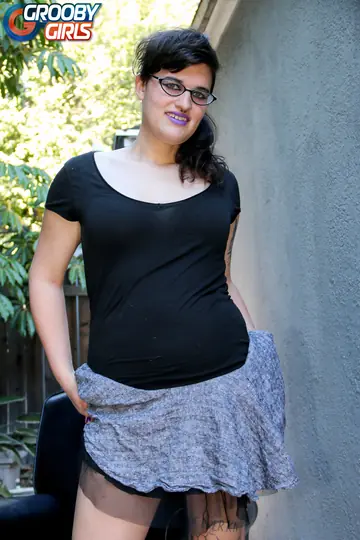 Thick Trans Woman Arches Back and Flaunts Her Figure Nude