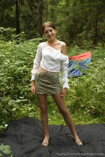 Slim Woman Strips on a Blanket in the Woods and Fingers Herself