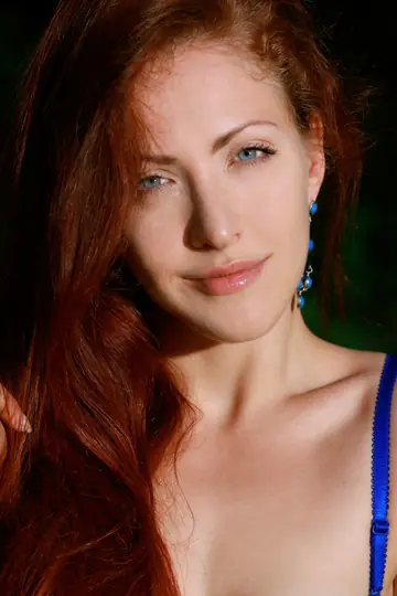 Pale Redhead Poses Nude Among Trees Outdoors