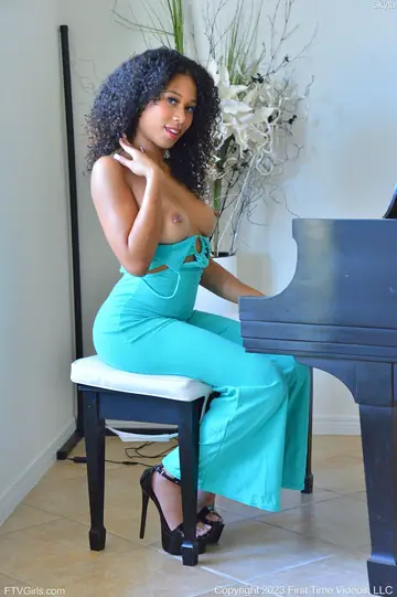 Ebony Woman Masturbates with a Dildo in High Heels at the Piano