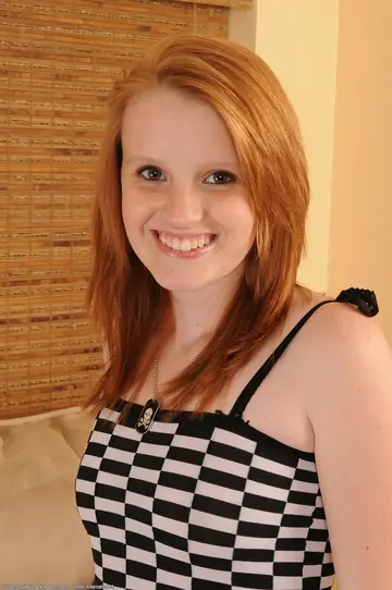 Skinny Redhead Strips Nude and Shows Her Tattoo