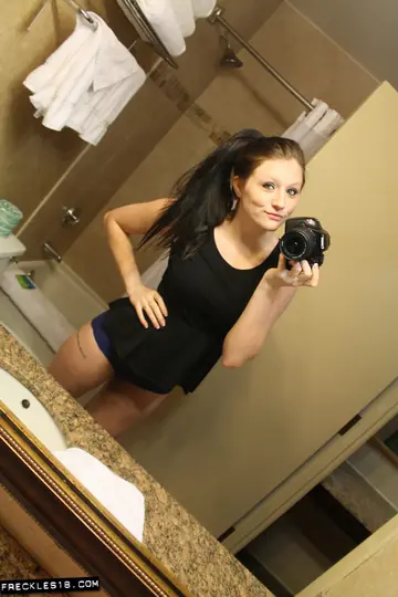 Brunette with Big Natural Tits Poses in Lingerie by the Mirror