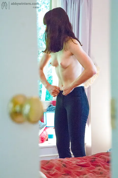 Tall Brunette Pulls on Jeans and Panties – photo 11 of 16