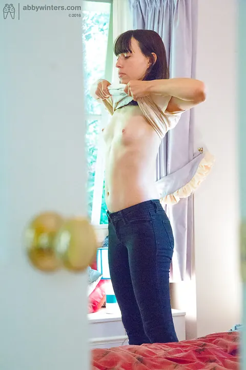 Tall Brunette Pulls on Jeans and Panties – photo 14 of 16