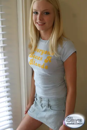 Skye Model – Blonde with Small Natural Tits and a Piercing Poses in a Skirt