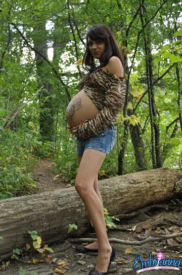 Pregnant Brunette Strips Out of Her Shorts in the Woods