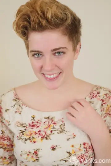 Short-Haired Redhead Touches Her Hairy Pussy and Uses a Dildo