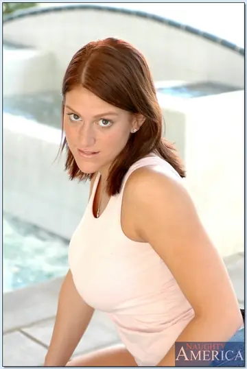 Thick Brunette with Big Tits Spreads by the Pool
