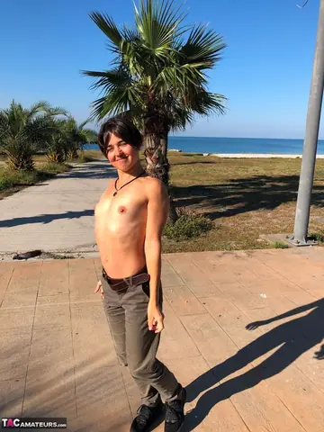 European Brunette Strips Out of Her Panties on a Concrete Stage