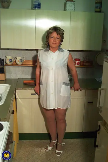 Petite Slim Woman Strips and Toys Herself in the Kitchen