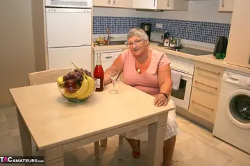 Busty European MILF Strips and Toys Her Pussy in the Kitchen