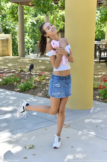 Tall Slim Amateur Lifts Her Denim Skirt Outdoors