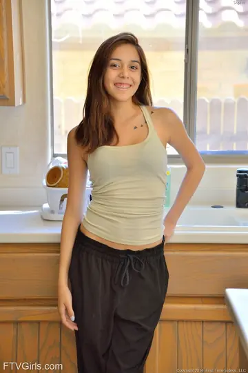 Kristina Bell – Slim Brunette Plays with a Vibrator on the Kitchen Counter
