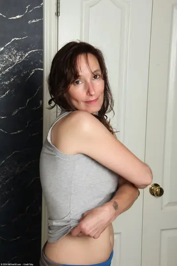 Celeste Carpenter – Brunette MILF with Natural Tits Undresses in the Bathroom